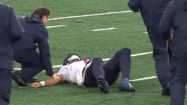 C.J. Stroud lays on the ground after taking a hit from the Jets defense.
